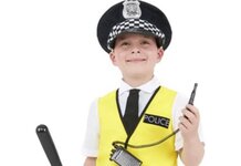 Rochdale – Police Given Emergency Powers to “Get Tough” After Bexley Brawl Young boy, smiling proudly, wearing police uniform holding a whistle and a truncheon