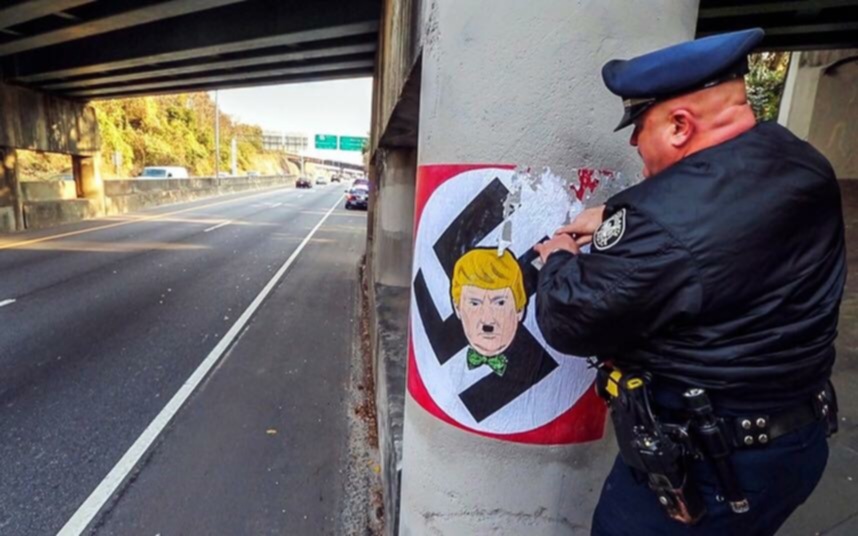 Trump voters deface police recruitment poster with Trump Sticker