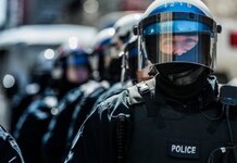 Heavily armed men in masks carrying clubs burn homes in Northern France