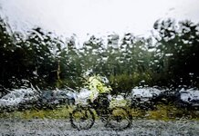 Prize boffin apparently unaware of weather Cyclist in rain