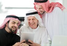 Arab men laughing