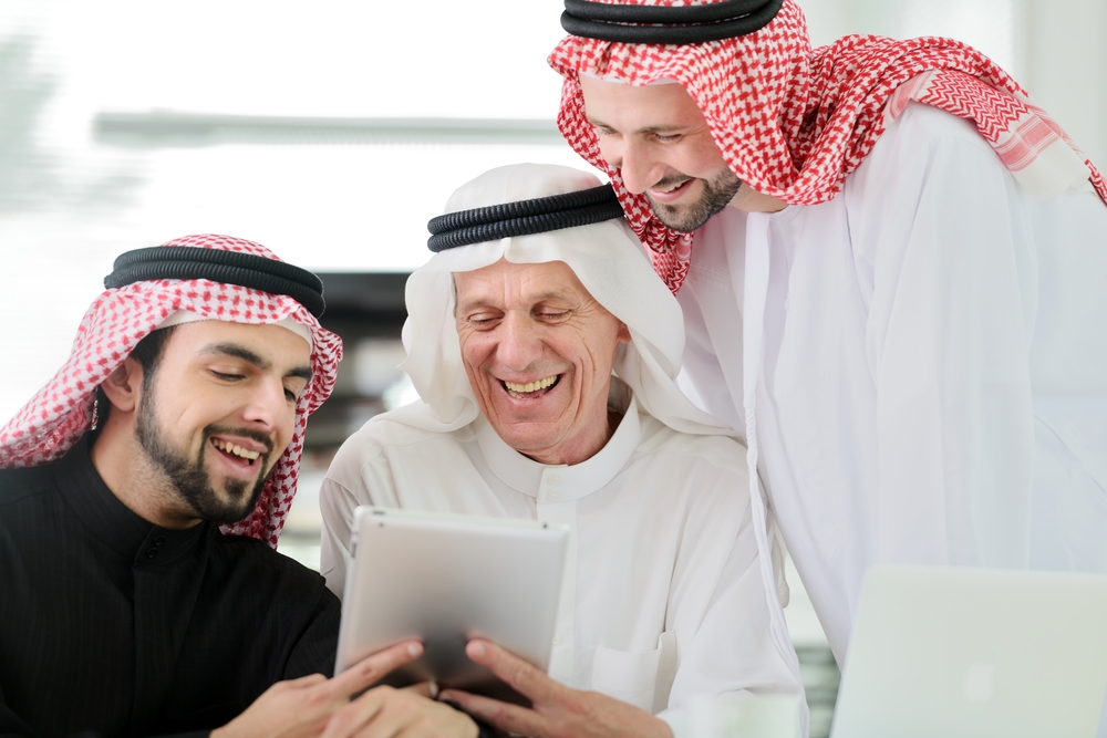 Arab men laughing
