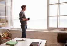Northern man puts teabag directly in bin without putting it in the sink Man with mug of tea