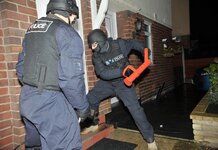 Hundreds arrested in dawn raids for not wearing a poppy