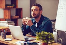 Dad thinking about thinking about starting his Christmas shopping Man thinking