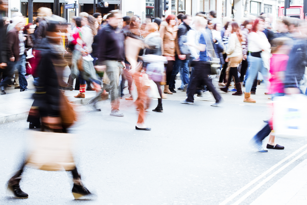 Woman walking through shopping crown